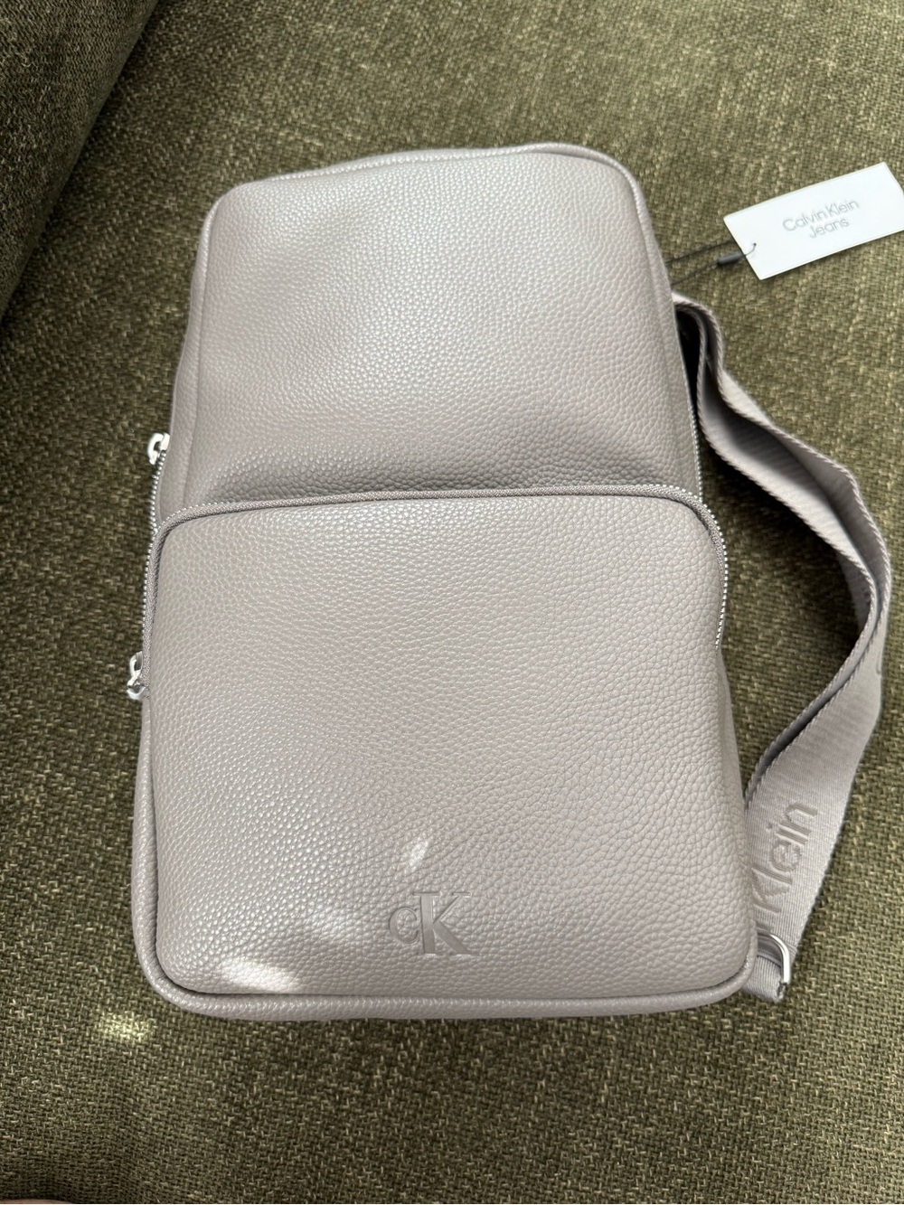 Calvin Klein Men’s Pebbled Light Gray Sling Bag